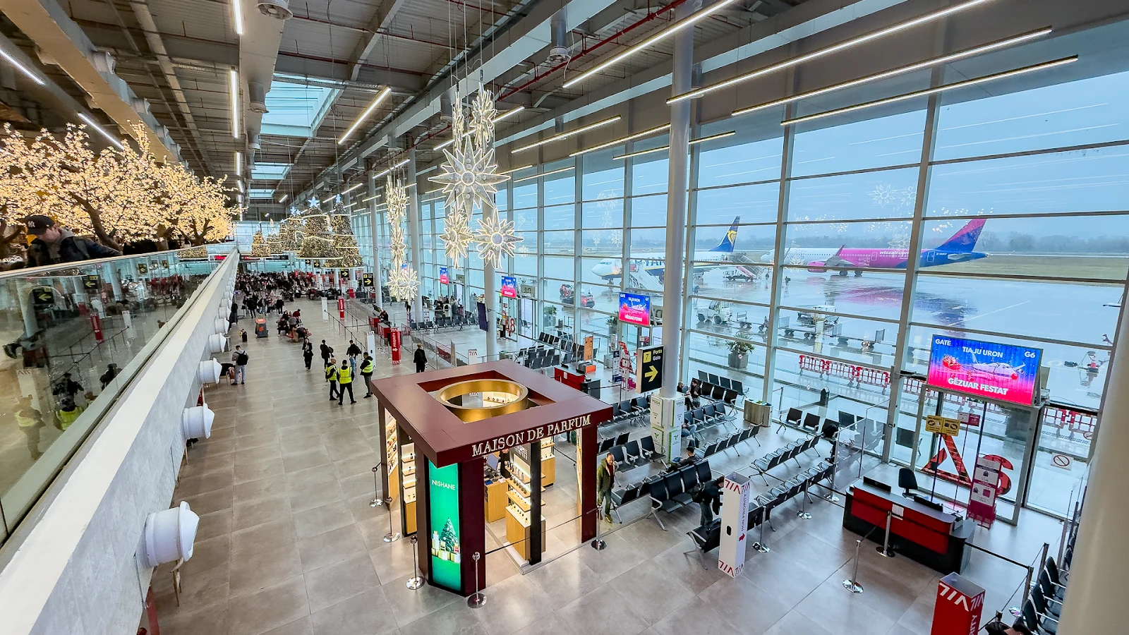Car rental vehicles parked at Tirana airport ready for passenger collection